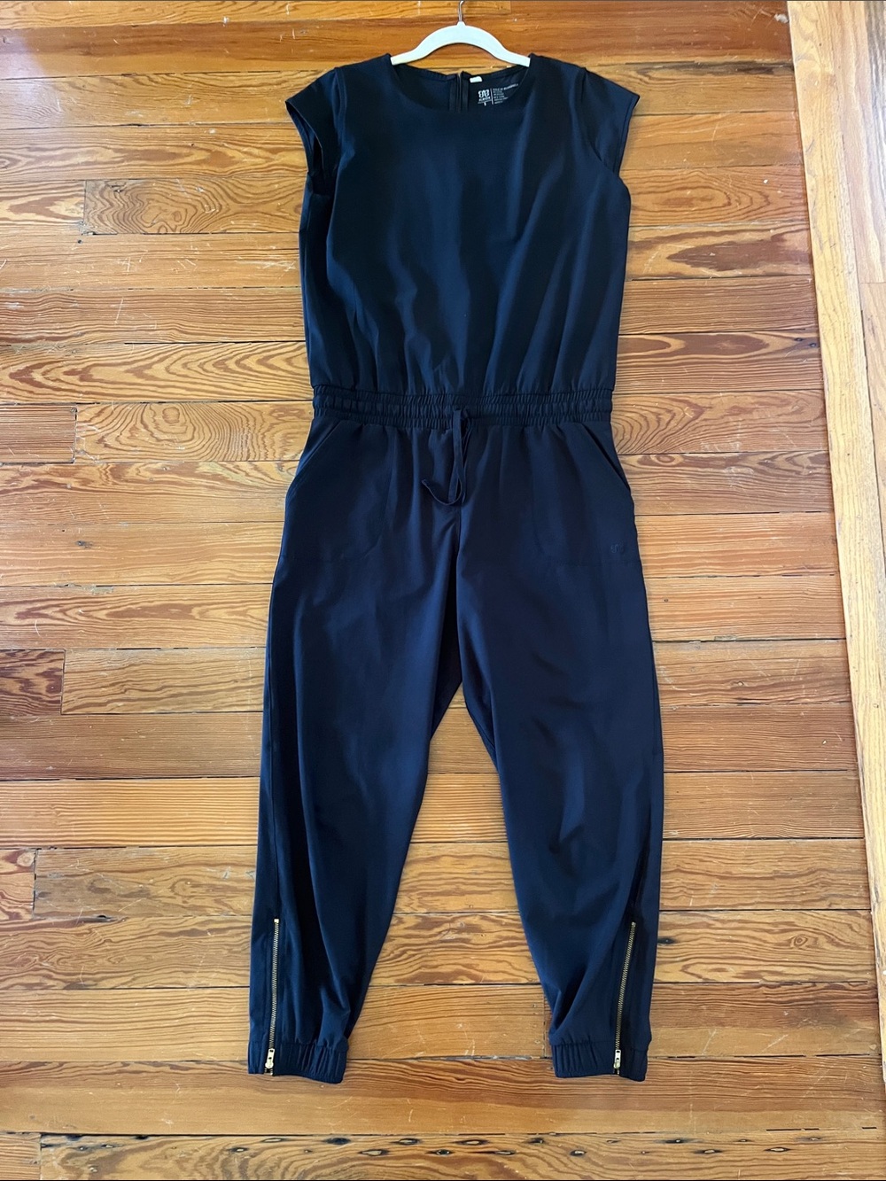 Black Cap-Sleeve Jumpsuit with Ankle Zippers